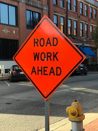 Road work ahead construction sign on the street