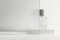 Perfume bottle mockup psd with patterned glass texture product backdrop