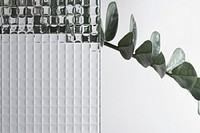 Nature background with leaf behind patterned glass