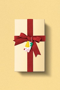 Gift box packaging mockup psd with red ribbon and plasticine patterned tag