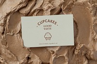 Pastries business card mockup psd on brown frosting texture