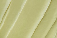 Green frosting texture background close-up