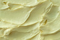 Yellow frosting texture background close-up