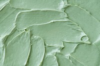 Green frosting texture background close-up