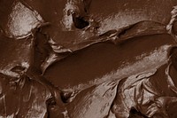 Brown frosting texture background close-up