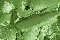 Green frosting texture background close-up