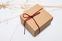 Kraft gift box with red bow rope in minimal style