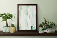 Picture frame psd mockup on a shelf with plants