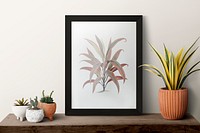 Picture frame psd mockup on a shelf with plants