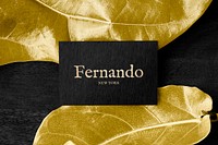 Florist name card mockup psd on gold leaves