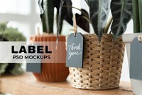 Label mockups psd on plants in a florist shop