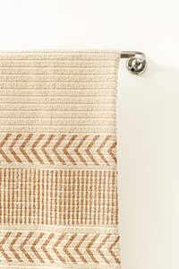 Bath towel mockup psd, hanging on a rack, home decor