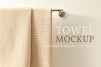 Bath towel mockup psd, hanging on a rack, home decor