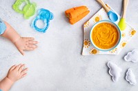 Healthy baby food background, organic carrot puree