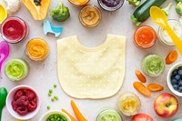 Cute baby bib background, organic food ingredients