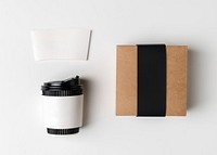 Coffee cup and paper sleeve, product packaging, flat lay design