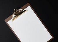 Blank white paper on brown clipboard, flat lay