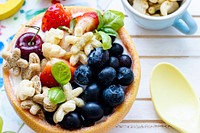 Kids cereal bowl treat with berries and yogurt