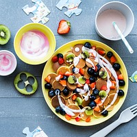 Kids mini pancakes treat, with kiwi and berries