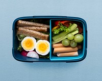 Healthy kids food lunchbox psd, with egg and greens