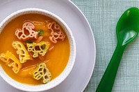 Carrot soup background, pasta animals, healthy food for kids wallpaper