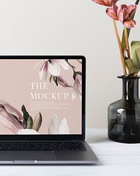 Laptop screen mockup psd, minimal workspace, pink flower decoration