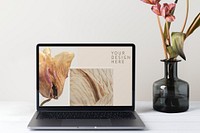 Laptop screen mockup psd, minimal workspace, pink flower decoration