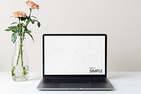 Laptop screen mockup psd, minimal workspace, pink flower decoration