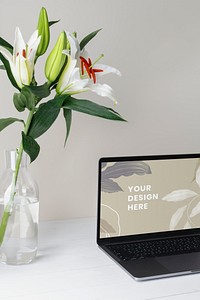 Laptop screen mockup psd, minimal workspace, white flower decoration