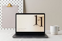 Laptop computer mockup psd, modern home interior decor, cup of coffee