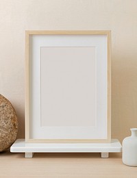 Empty picture frame, clean beige home interior decor