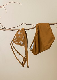 Tropical bikini mockup, women&rsquo;s swimwear in brown design psd