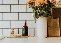 White aesthetic kitchen with natural products and flowers