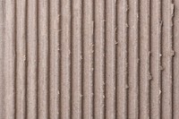 Corrugated paper texture, brown background