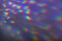 Neon lens flare prism rainbow light reflection on black background 