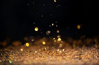 Gold falling glitter sequin confetti on black background