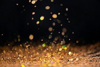 Gold falling glitter sequin confetti on black background