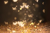 Gold glitter butterfly bokeh sequin confetti on black background