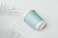 Blue paper cup with palm leaf shadow mockup