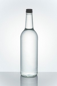 Mineral water in a clear glass bottle mockup 