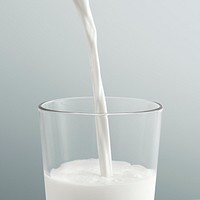 Close up of pouring milk into a glass