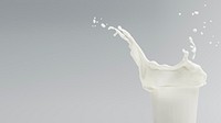 Fresh milk splashing from a glass