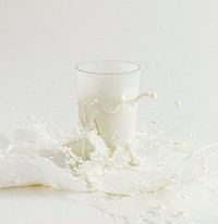 Fresh milk splashing from a glass