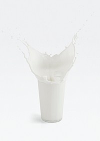 Fresh milk splashing from a glass