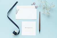 Floral paper notes template mockup on a blue background