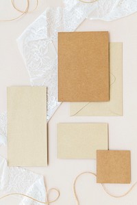 Blank natural paper note set on a white lace fabric