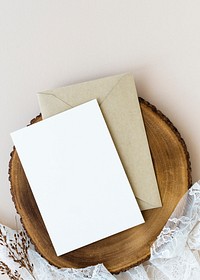 Blank white card on a wooden plate