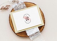 Floral card template mockup on a wooden plate