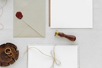 White paper notes and envelope on fabric textured background