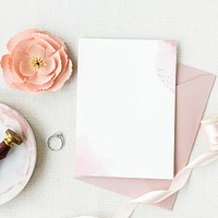 Wedding card template mockup with a diamond ring and a pink rose